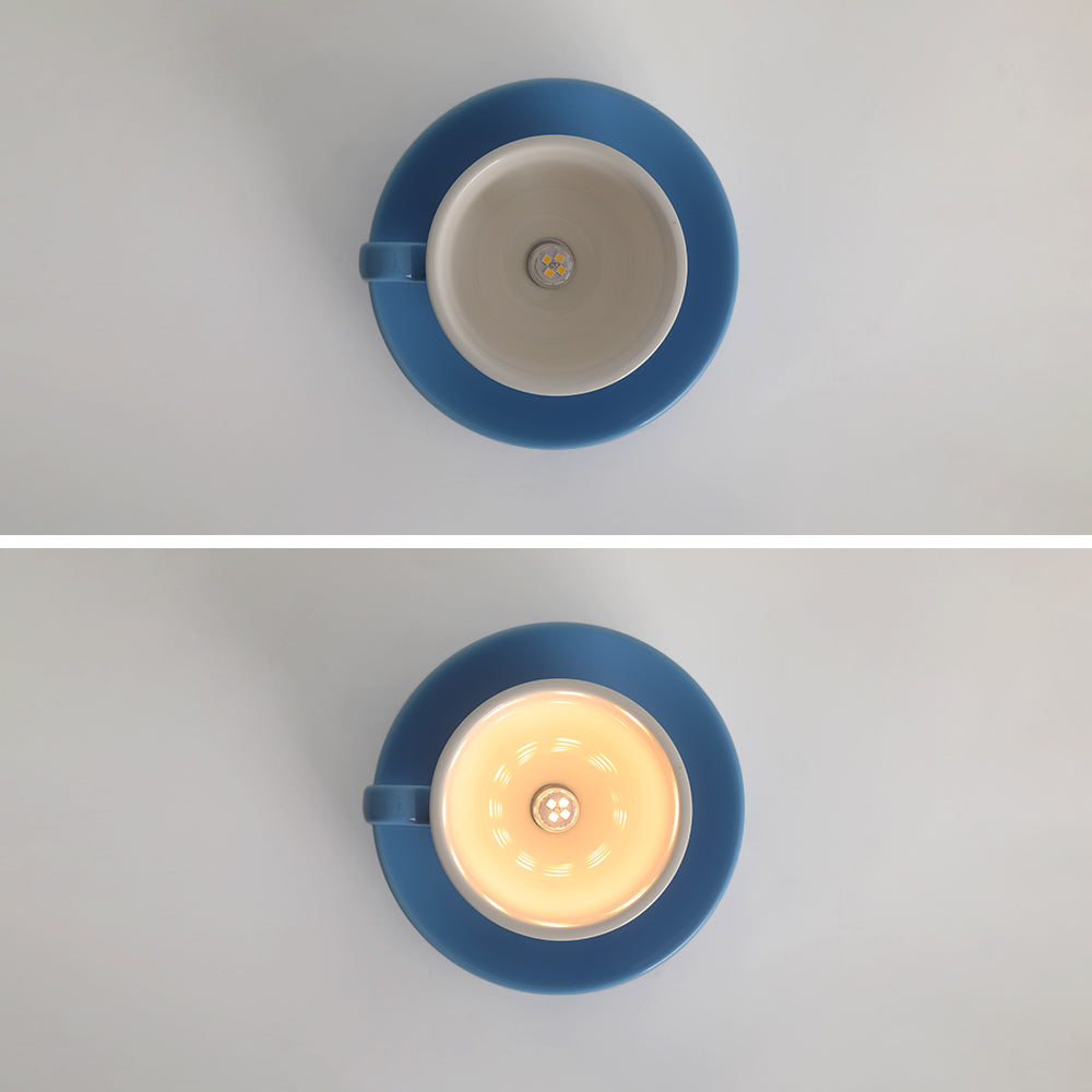 Top-down view of the blue teacup kupce ceiling light showing the unlit and illuminated G4 bulb socket