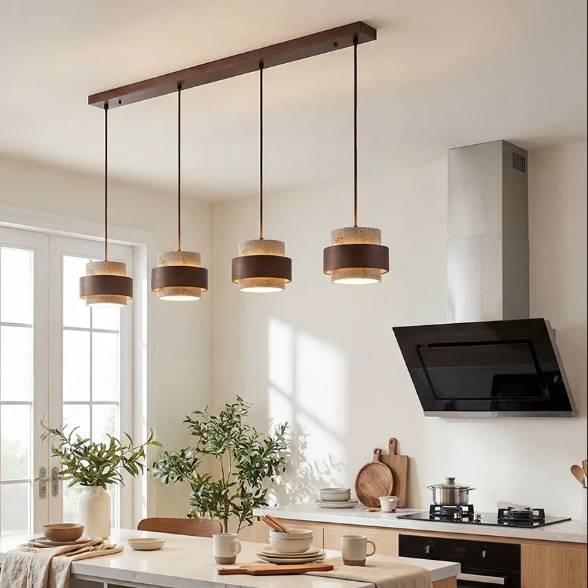 4-head travertine stone linear kyra pendant acting as a striking kitchen island light fixture