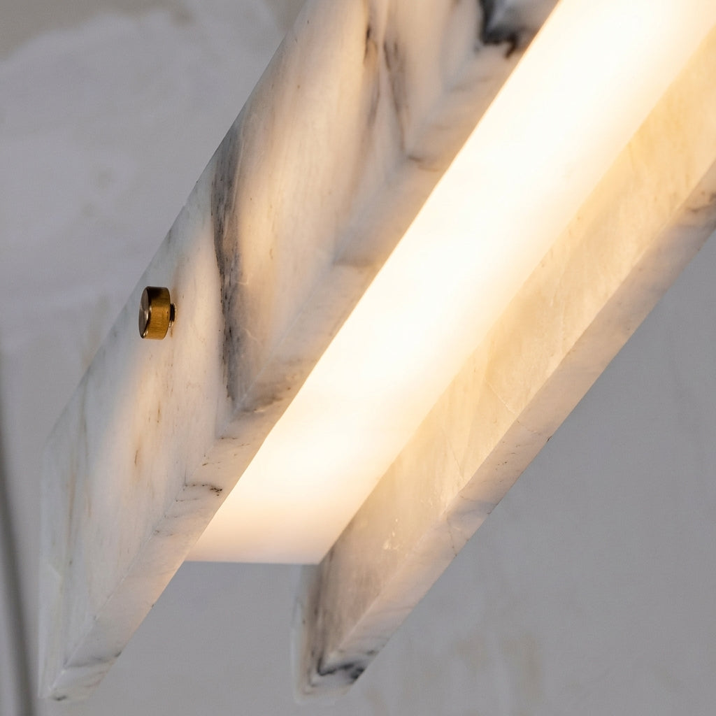 Levon alabaster linear chandelier glowing alabaster slabs with natural veining, close-up
