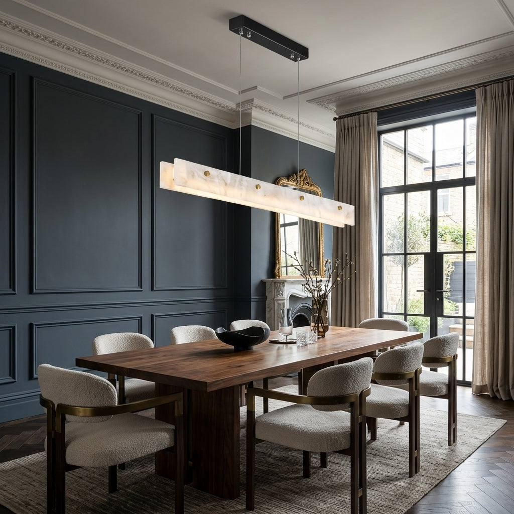 Levon alabaster linear chandelier above a walnut dining table in a panelled dining room