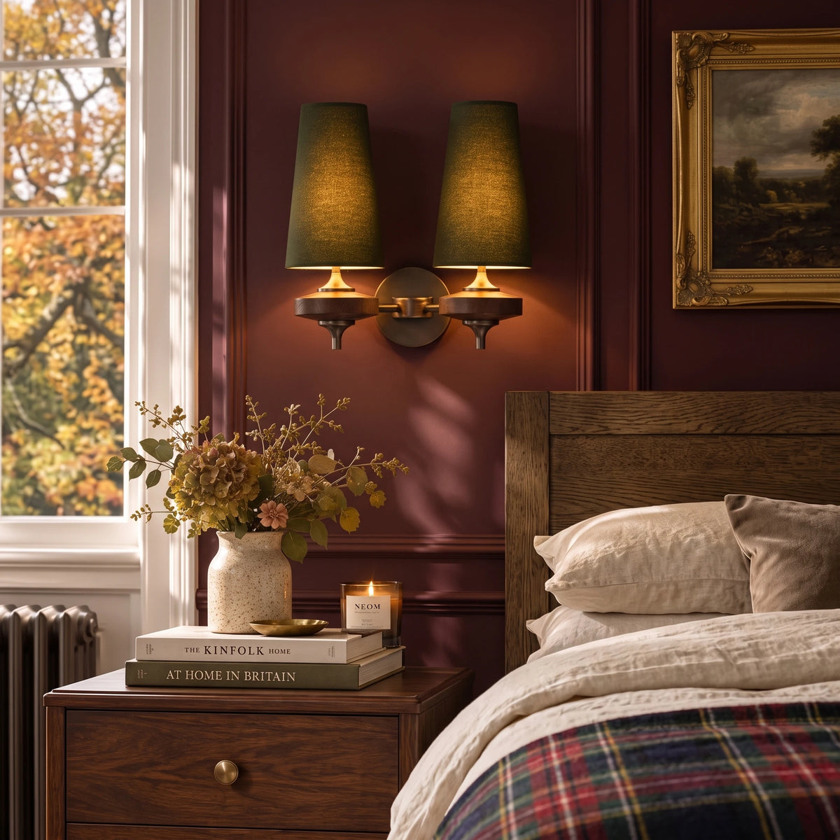 Lisk green 2-head fabric shade wall light on an oxblood bedroom wall above a bed with a tartan blanket