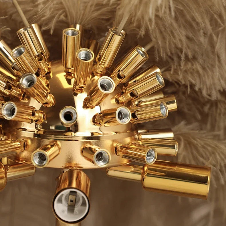 Close-up of the gold bulb holder cluster of the Lorne feather lamp beneath the feathers