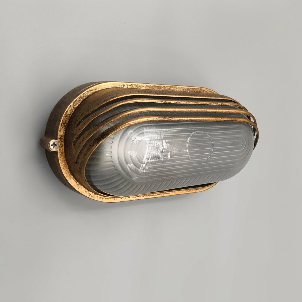 Lude bronze bulkhead wall light with ribbed frosted glass shade and ridged hood on a plain grey background