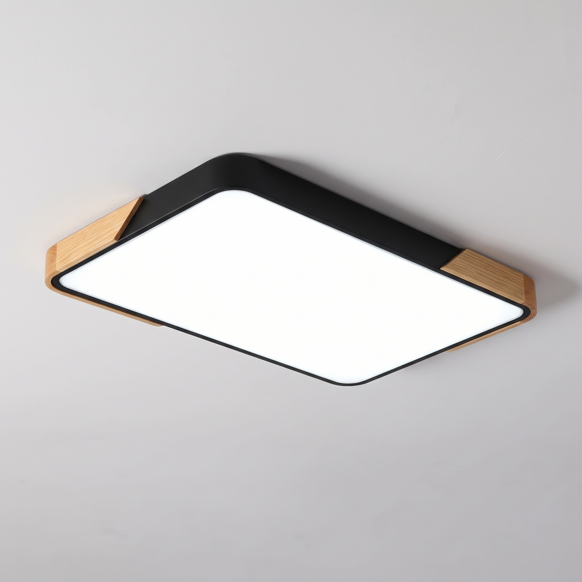 Mavon black rectangular slim LED flush mount ceiling light with wood corner trim, fitted flat to a ceiling