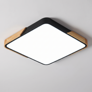 Mavon black square slim LED flush mount ceiling light with wood corner trim, fitted flat to a ceiling