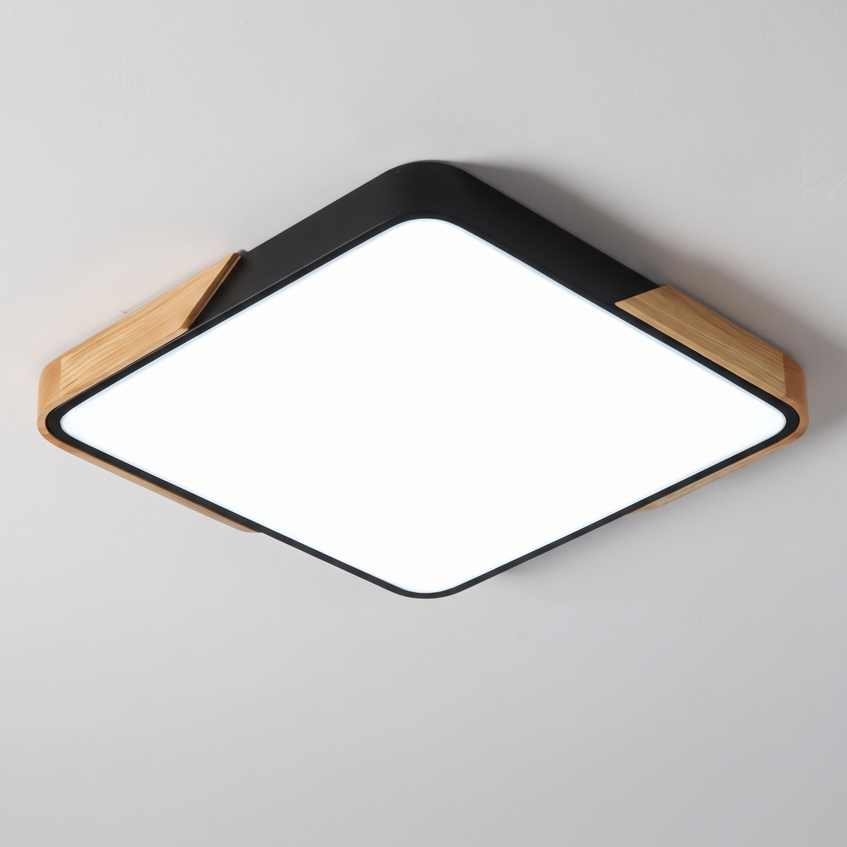 Mavon black square slim LED flush mount ceiling light with wood corner trim, fitted flat to a ceiling