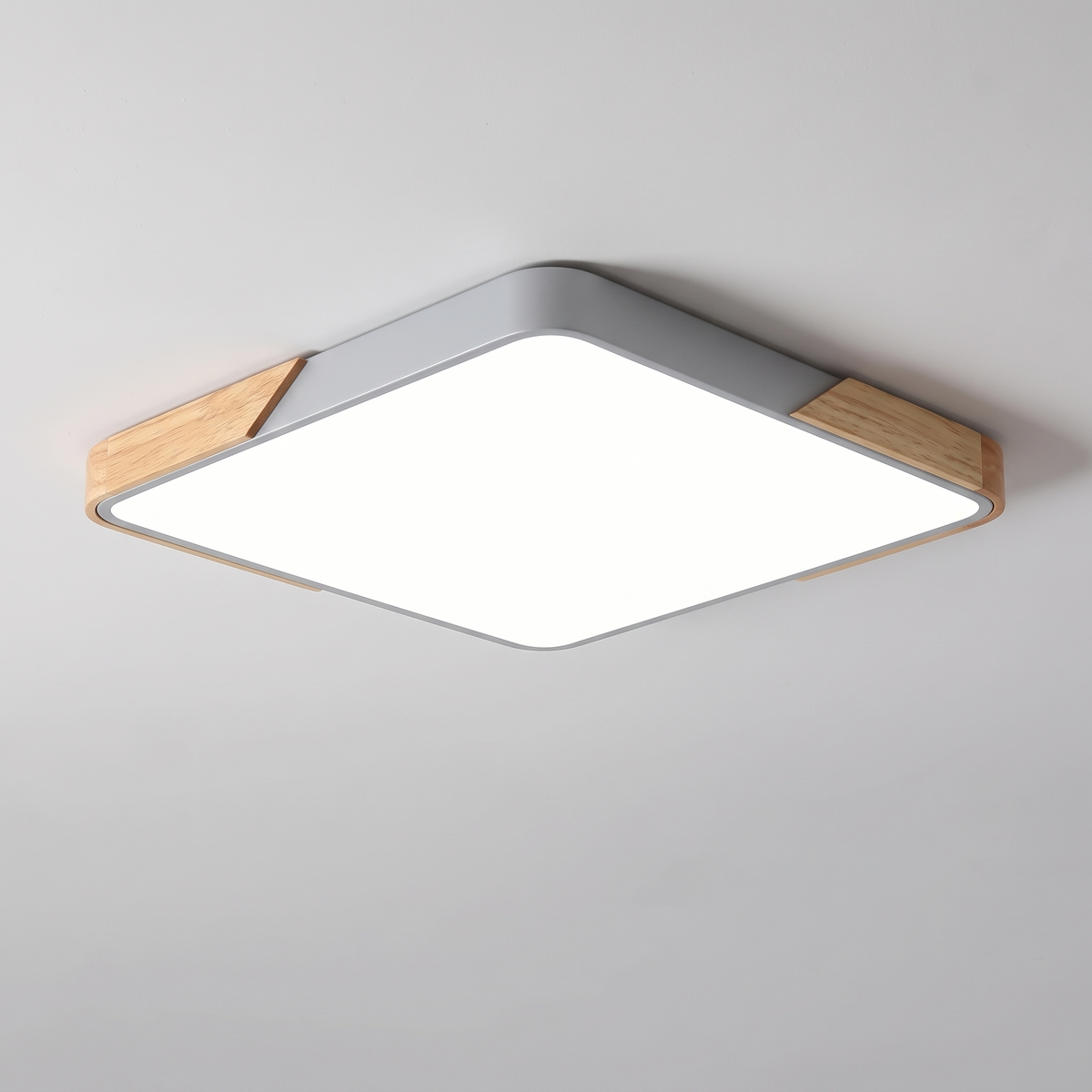 Mavon silver grey rectangular slim LED flush mount ceiling light with wood corner trim, fitted flat to a ceiling