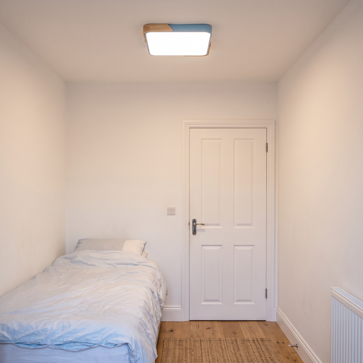 Mavon sky blue 40cm x 40cm slim LED flush mount ceiling light in a single bedroom