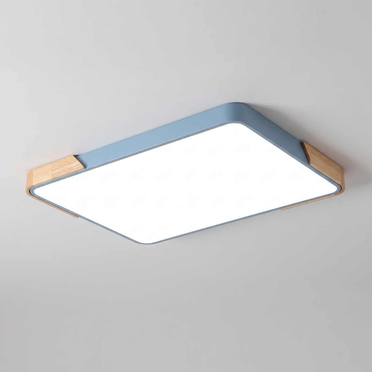 Mavon sky blue rectangular slim LED flush mount ceiling light with wood corner trim, fitted flat to a ceiling
