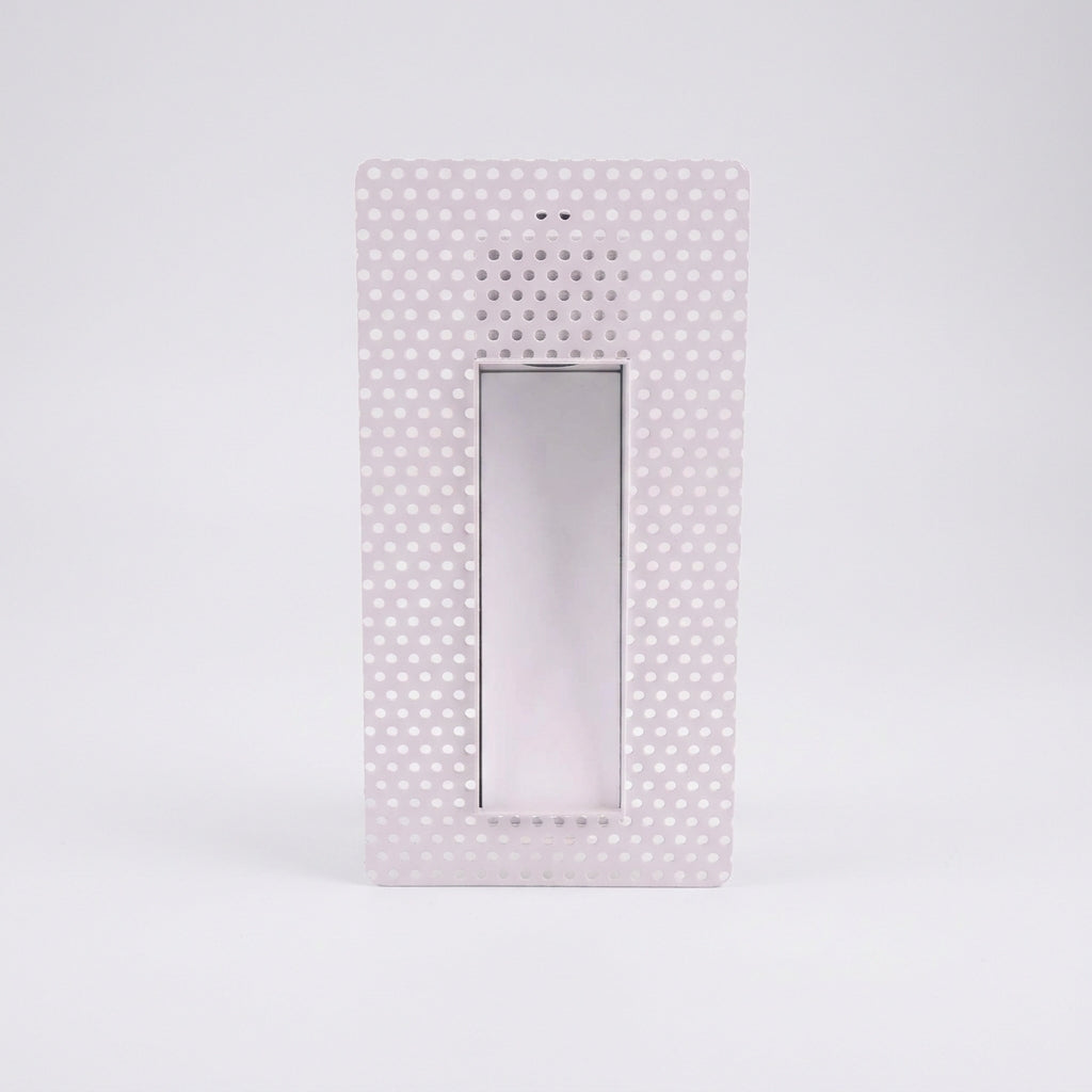 Melte white long strip perforated recessed LED wall light on a light grey studio background
