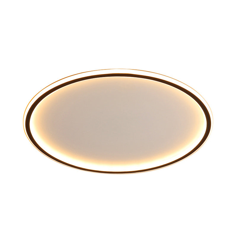 Front view of the illuminated black halo ring flush mount merqi ceiling light showing its thin 5cm profile