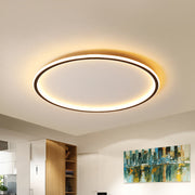 Modern merqi black halo ring LED flush mount ceiling light illuminating a contemporary living space
