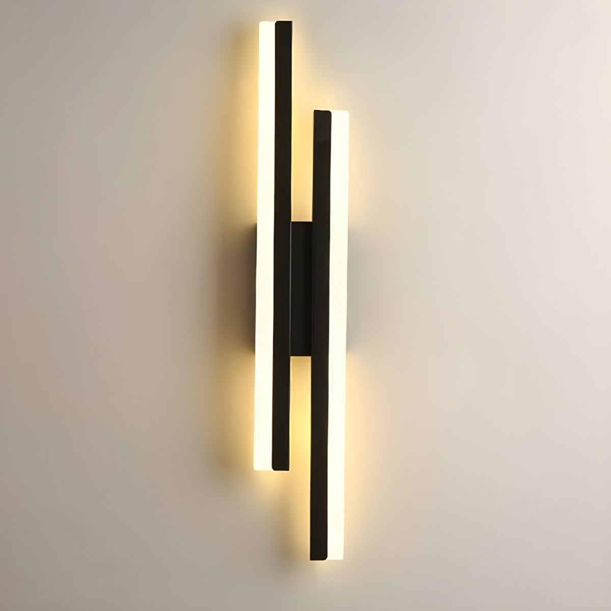 Glowing milor black asymmetrical LED wall light featuring a minimalist staggered acrylic design