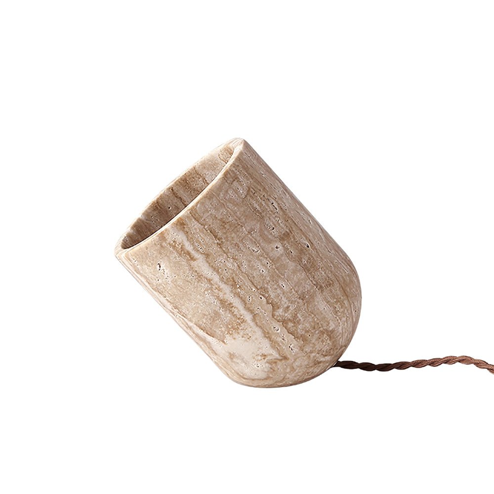 Unlit minimalist yellow travertine misa lamp showcasing the earthy veining and angled cut of the solid stone