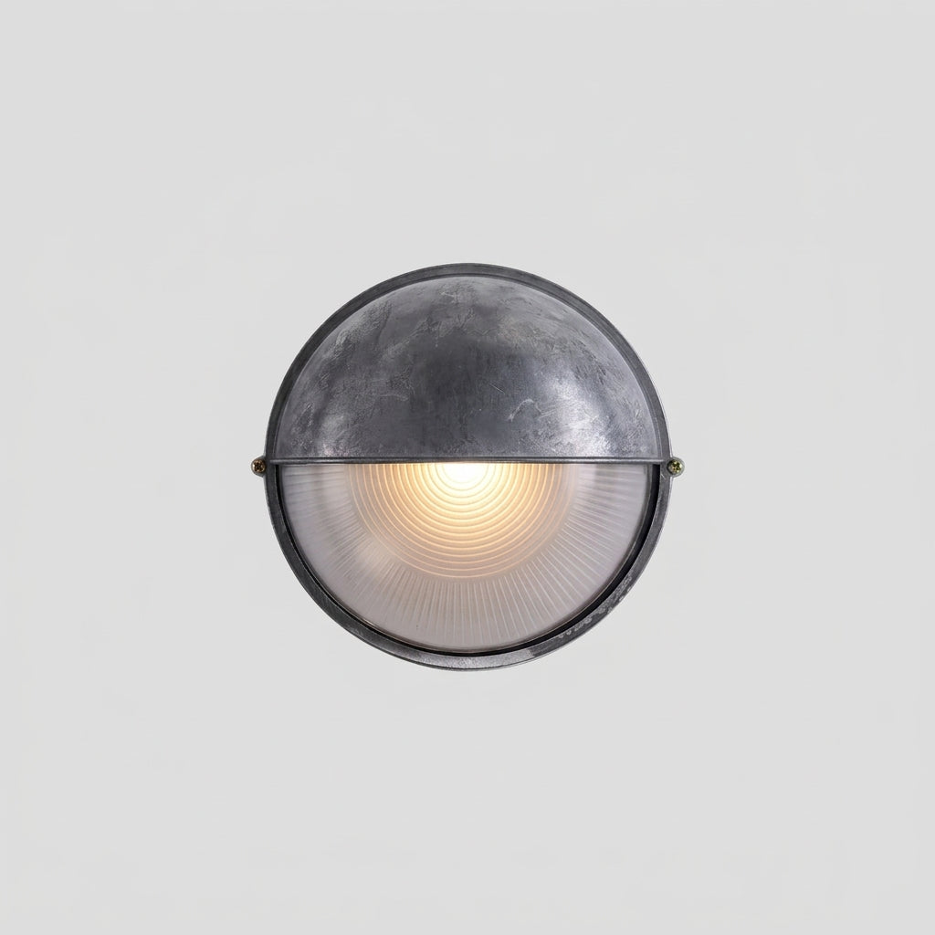 A vintage dome-shaped industrial outdoor wall light fixture with weathered grey metal frame, shown on a plain light grey background.