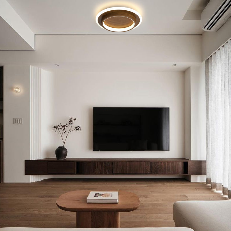 brown halo LED flush mura ceiling lamp installed in a contemporary living room above a television