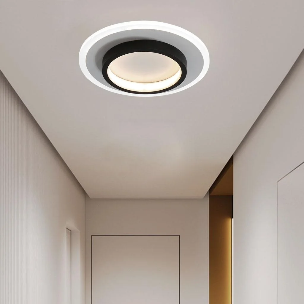 Single minimalist black double-ring flush mount mura ceiling light in a bright white hallway