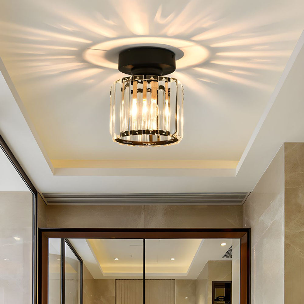 Modern black round crystal flush mount netyf light in a minimalist home entryway