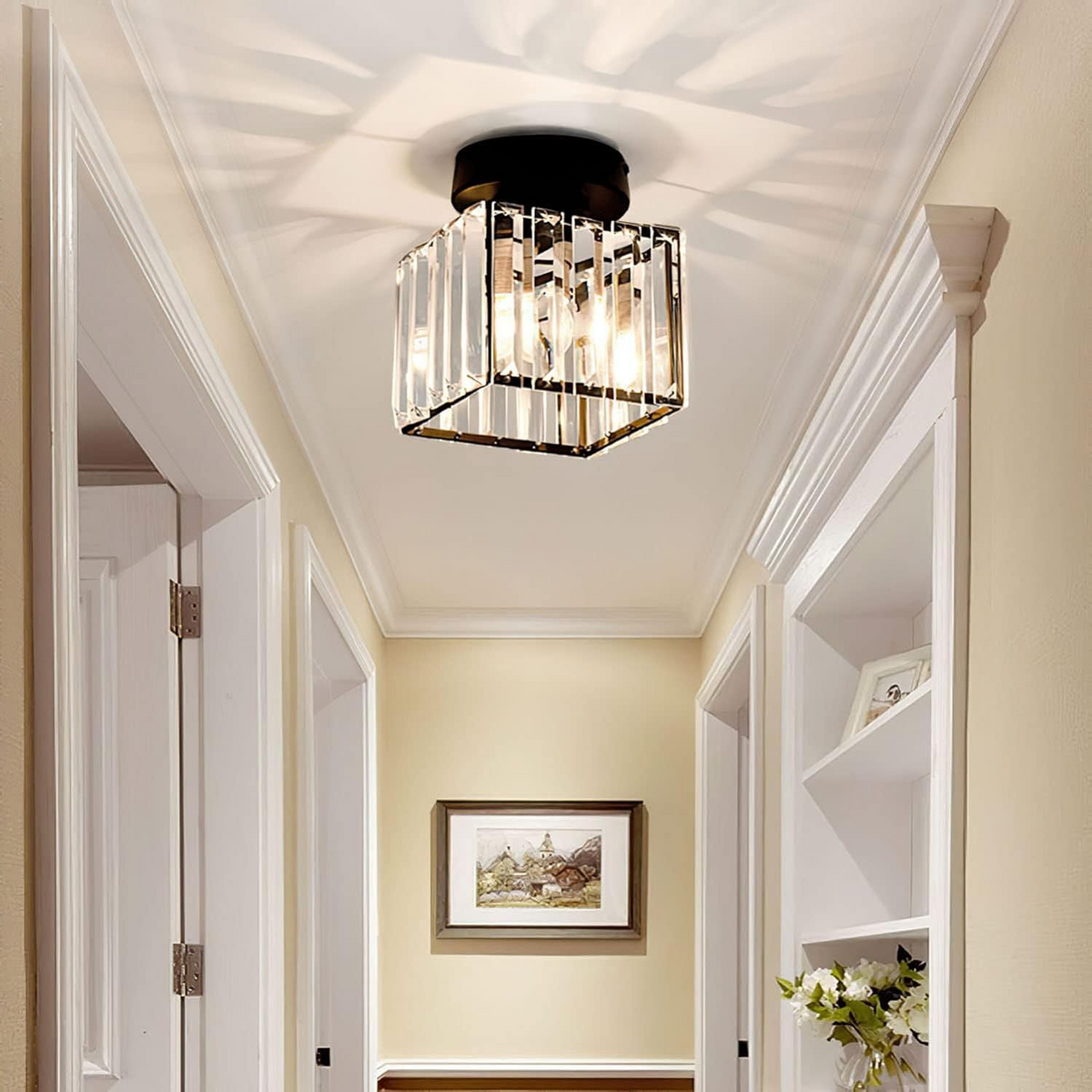 Modern black square crystal netyf flush mount light illuminating a bright home entryway