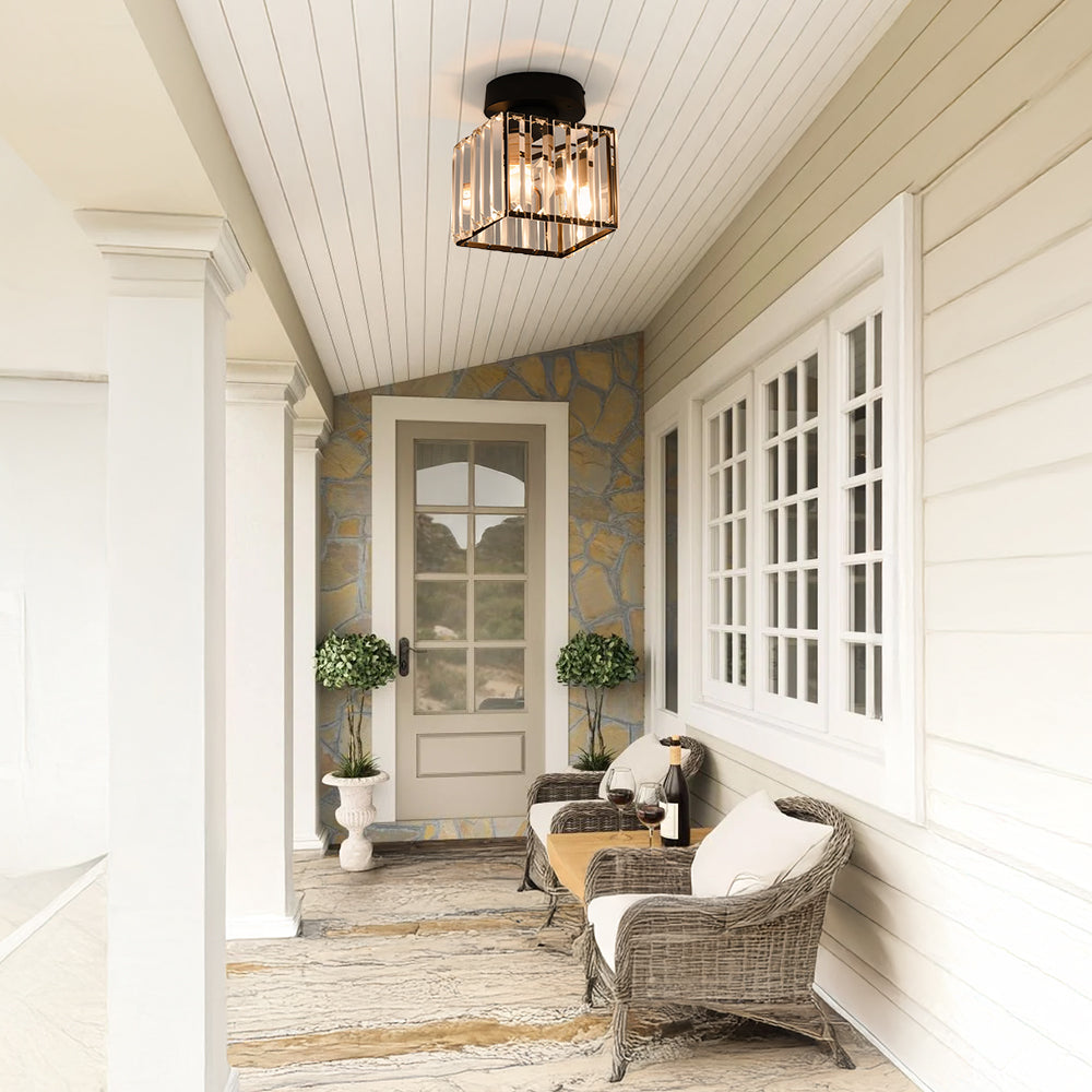 Black square crystal flush mount netyf fixture installed on a covered porch ceiling