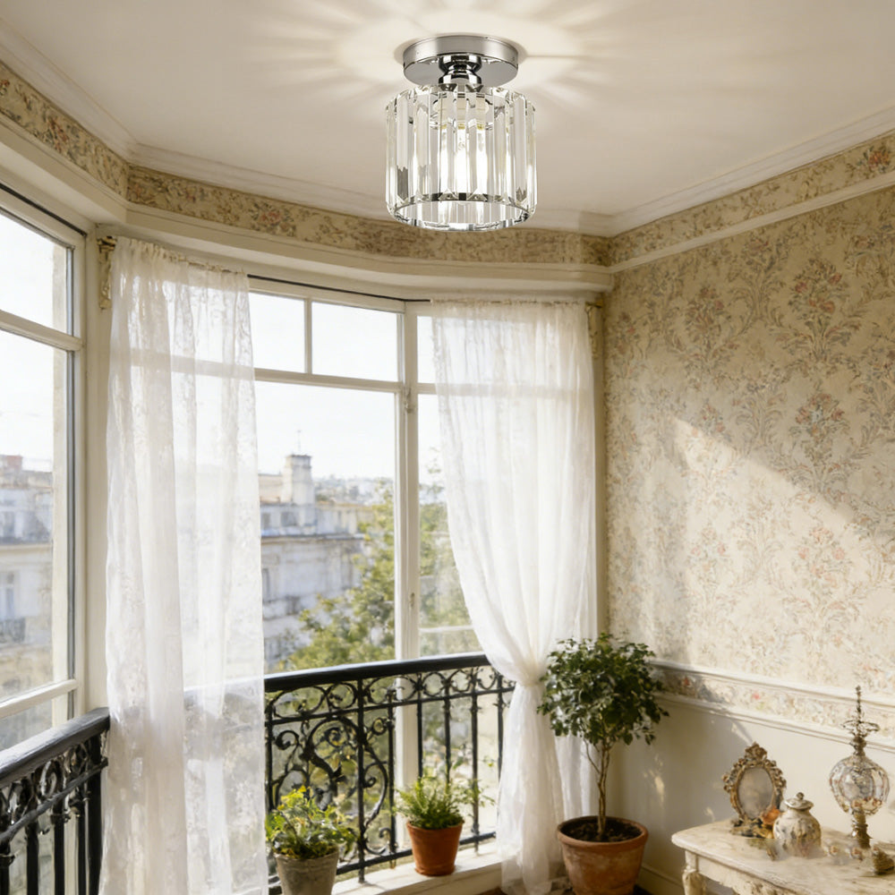 Silver round crystal netyf ceiling lamp illuminating a classic dining and living area