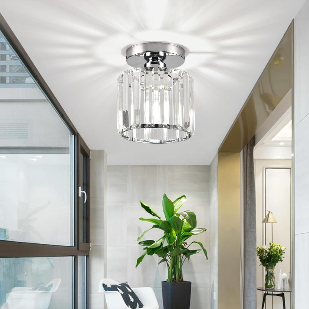 Silver round crystal netyf ceiling lamp installed in a modern, naturally lit living room