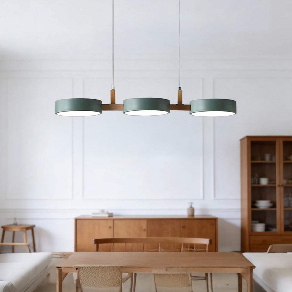 Solid green linear nohit chandelier acting as an architectural focal point in a minimalist living space