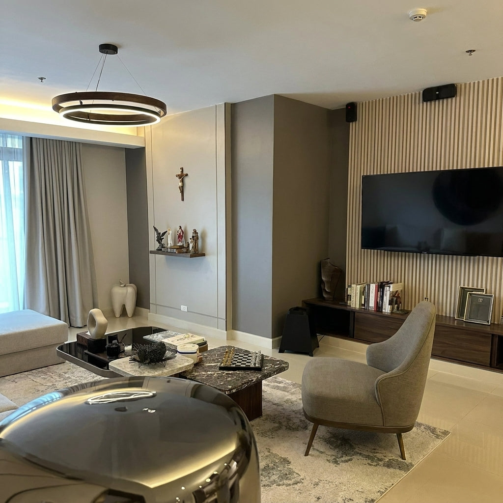 Nyles two-ring wood-grain LED chandelier in a living room with a linen armchair and wool rug