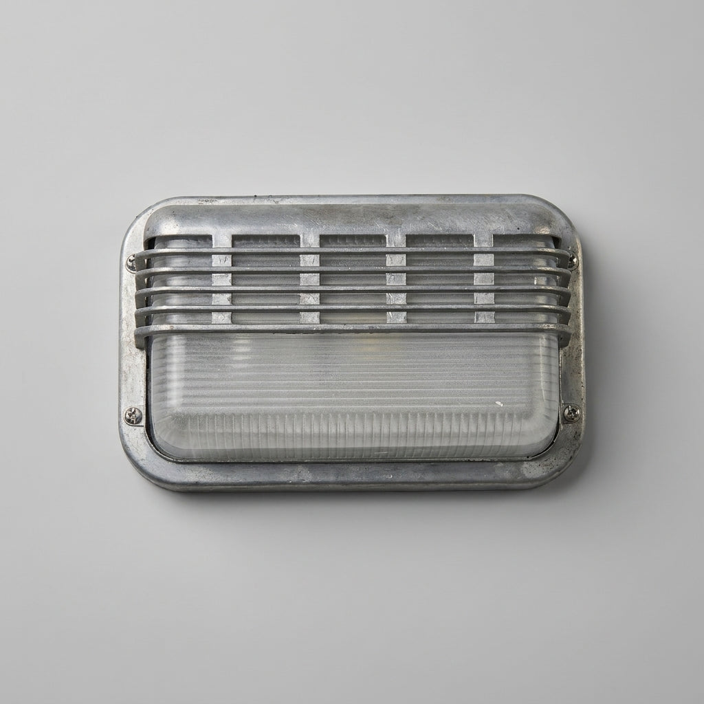 Ostin landscape louvred cage bulkhead wall light unlit on a grey wall