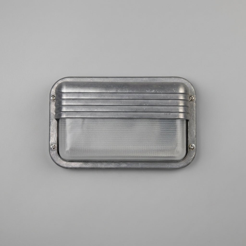 Ostin landscape louvred hood bulkhead wall light unlit on a grey wall