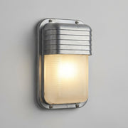 Ostin portrait louvred hood bulkhead wall light lit on a grey wall