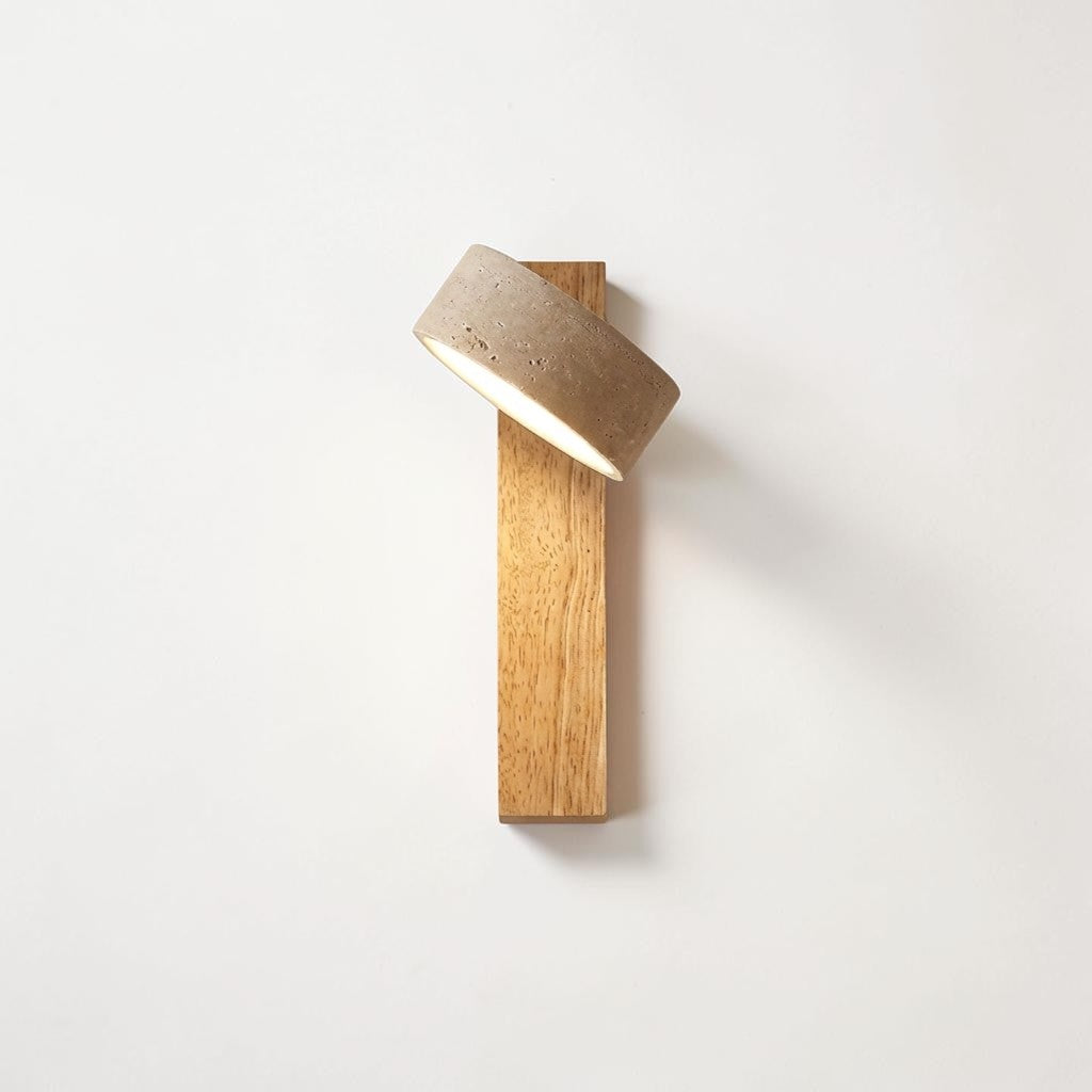 Pexni wabi sabi wall light with rotatable travertine stone shade on log wood backplate, mounted on a white wall