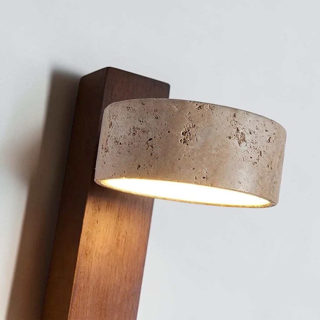 Pexni wall light in walnut finish showing the travertine stone details from up close 
