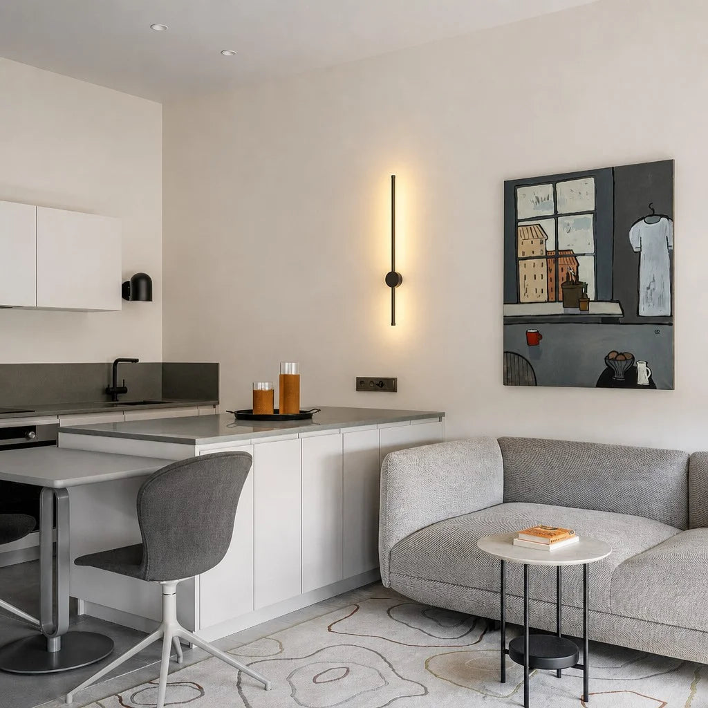 Vertical pila black linear LED wall light illuminating a contemporary kitchen and lounge