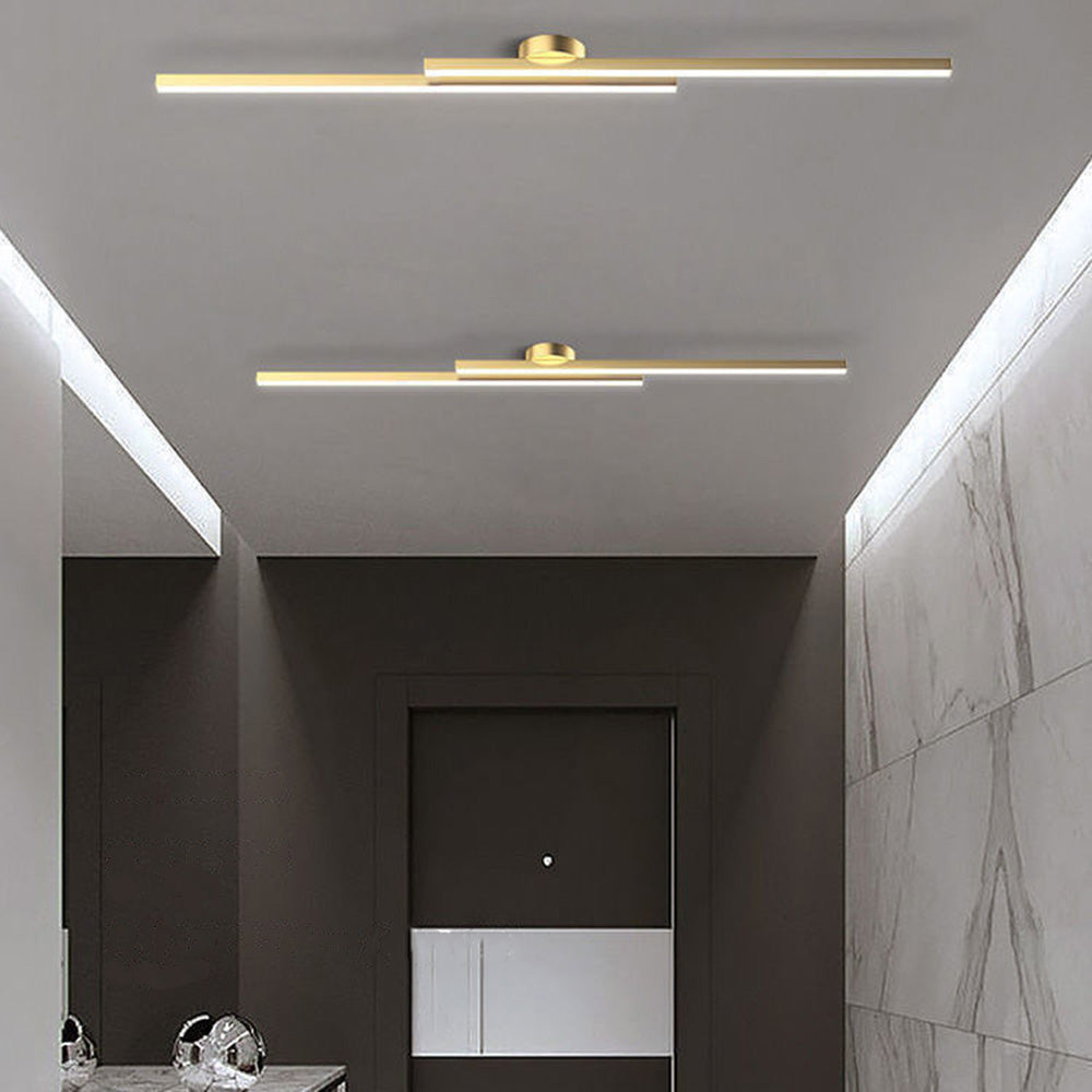 Elegant gold double-bar poxu ceiling lamp illuminating a luxurious contemporary hallway