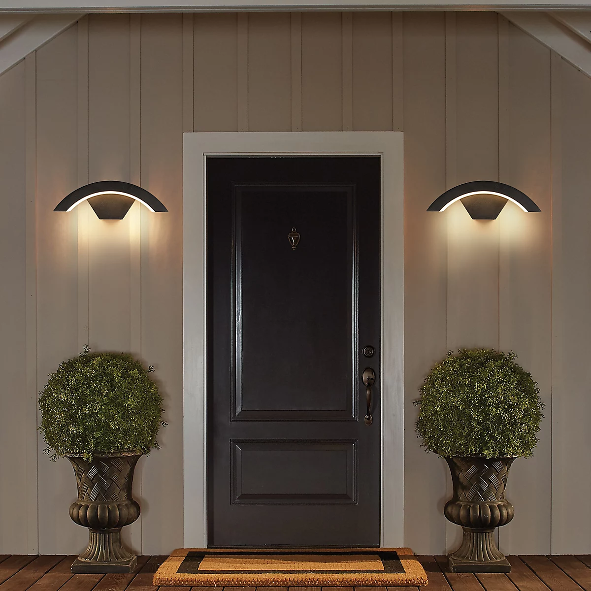 Pair of qaxo modern arched outdoor porch lights flanking a classic dark front door