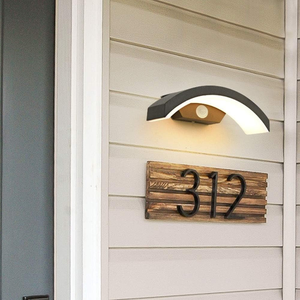 qaxo modern outdoor wall light providing ambient illumination above a wooden house number plaque