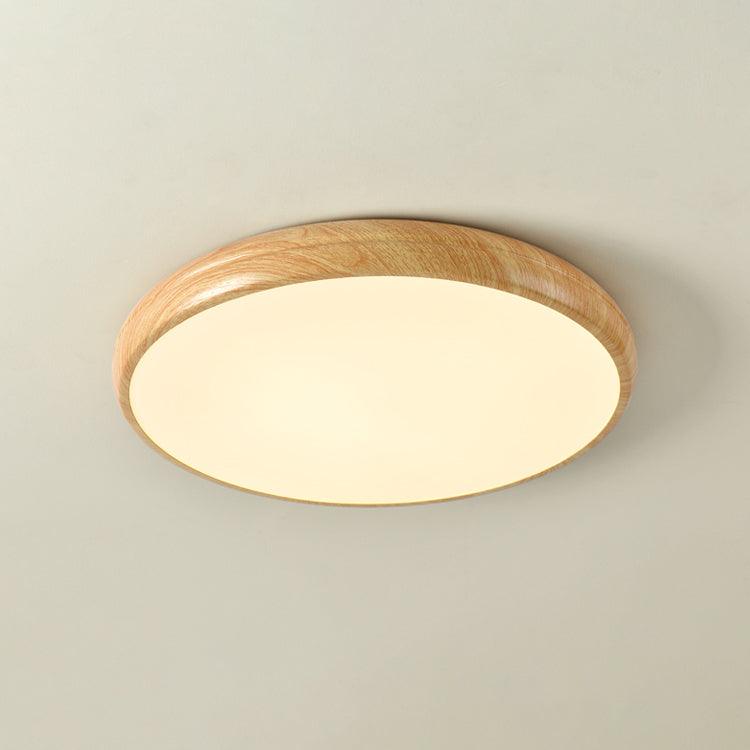 Angled view of the curved light oak wood-effect flush mount qexi ceiling light