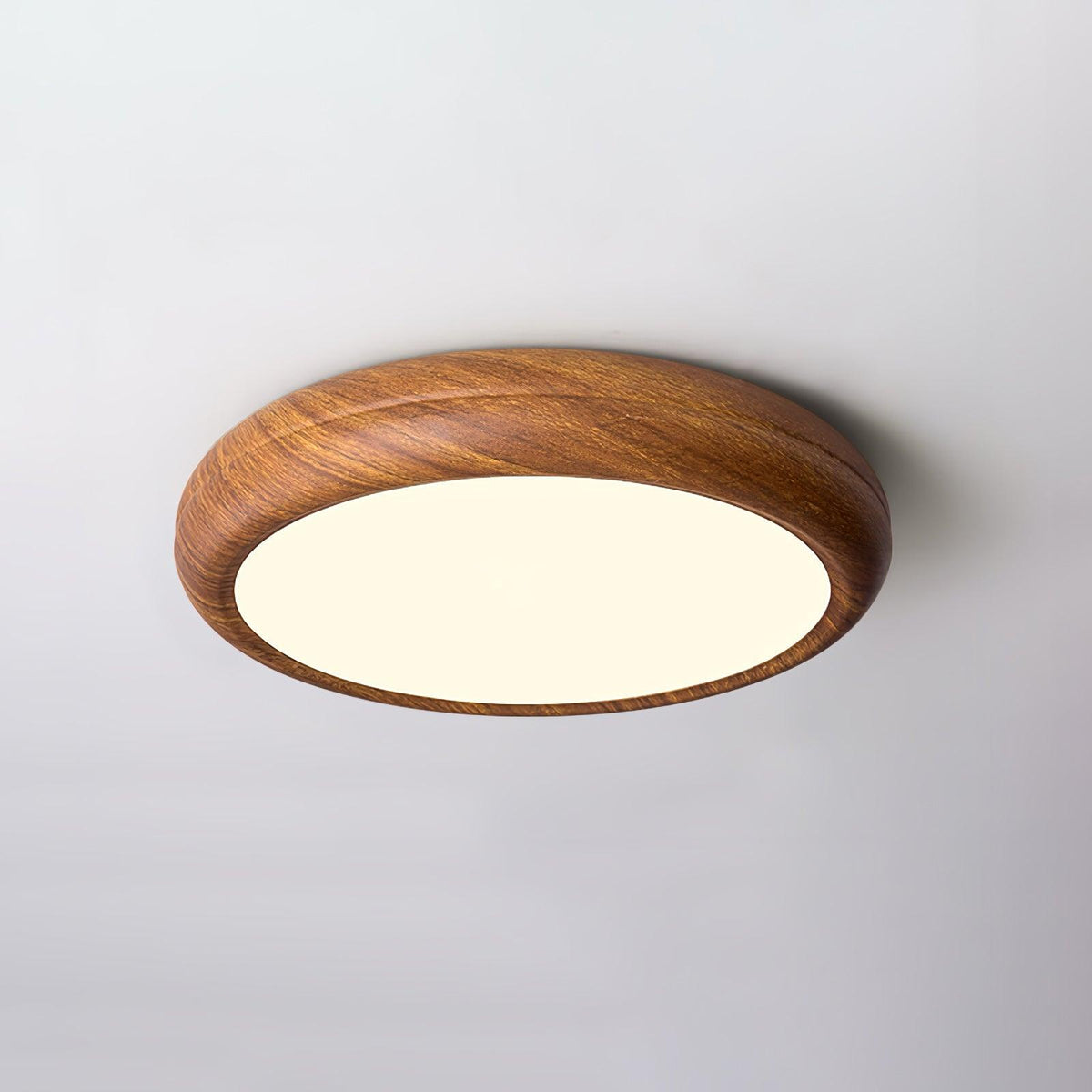 Angled view of the curved walnut wood-effect LED qexi ceiling lamp