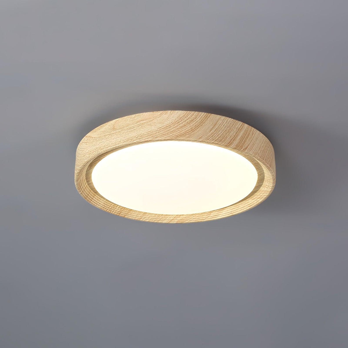 Angled view of the straight edge light oak wood-effect qexi flush mount