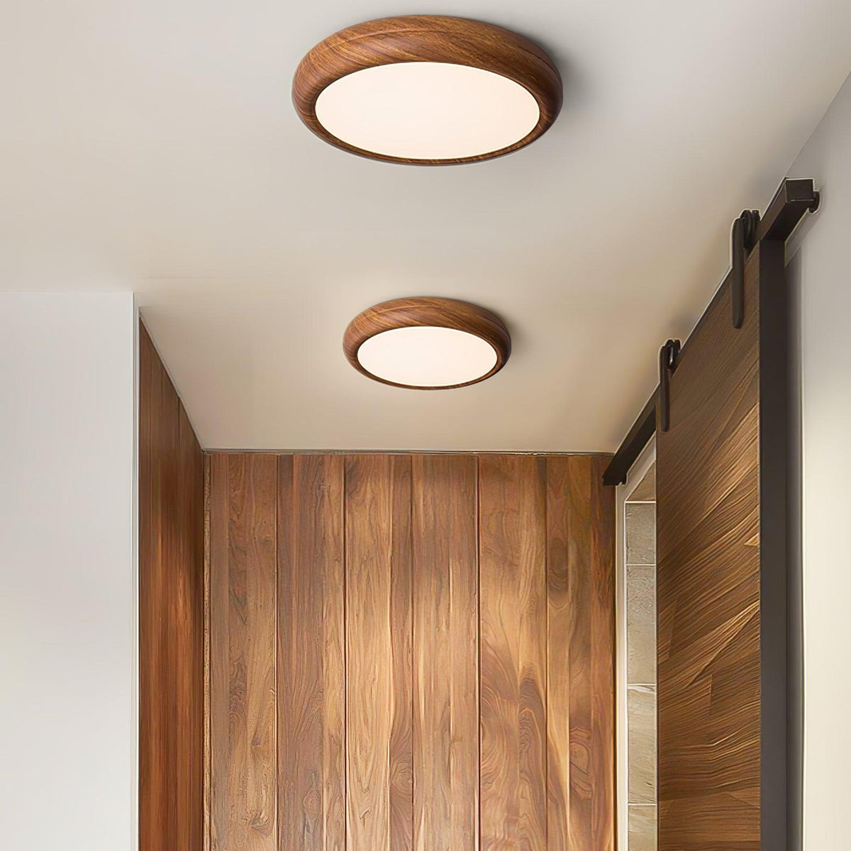 Pair of walnut wood-effect flush mount qexi ceiling lights in a contemporary hallway