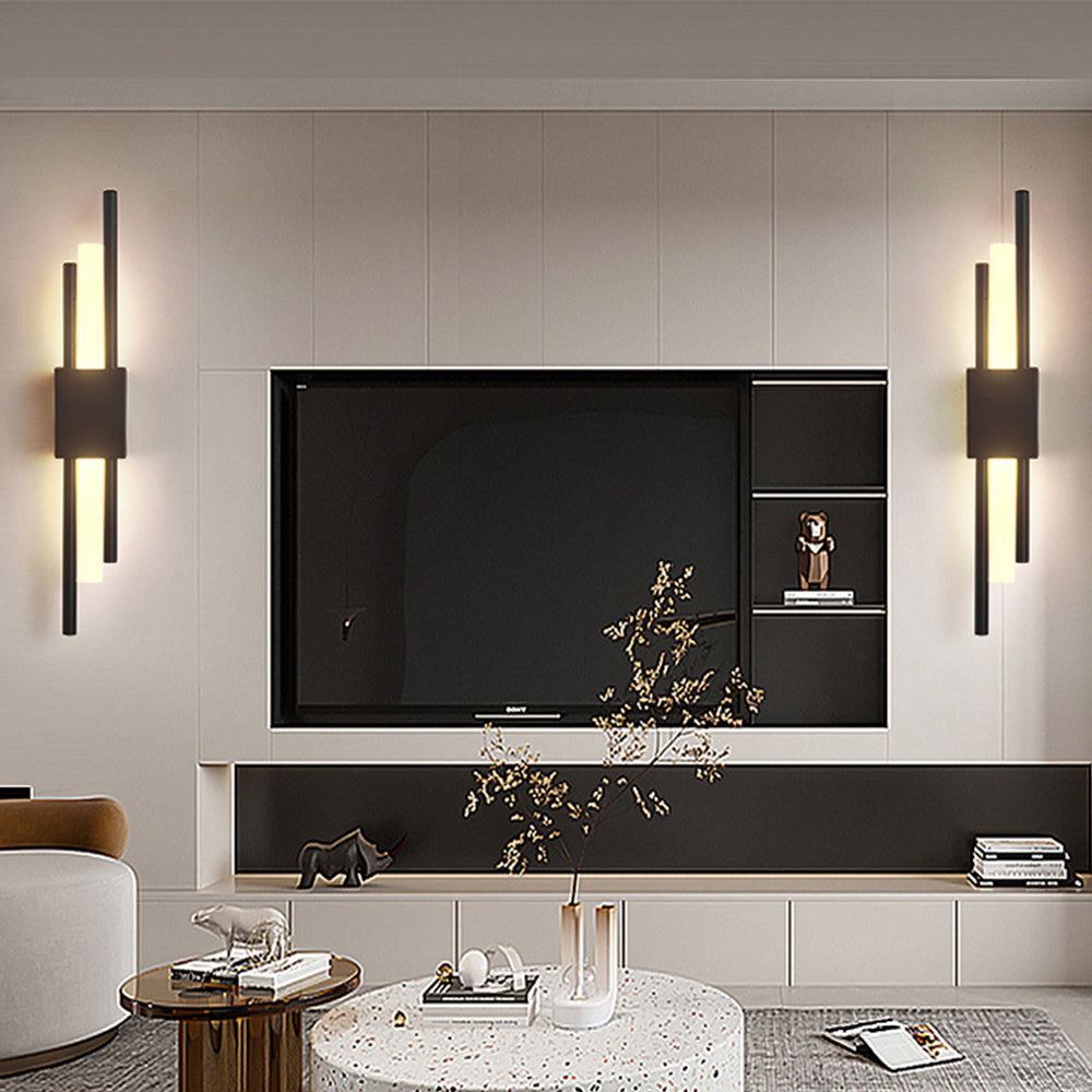 Black geometric qytu wall lights installed on either side of a living room television for ambient viewing light