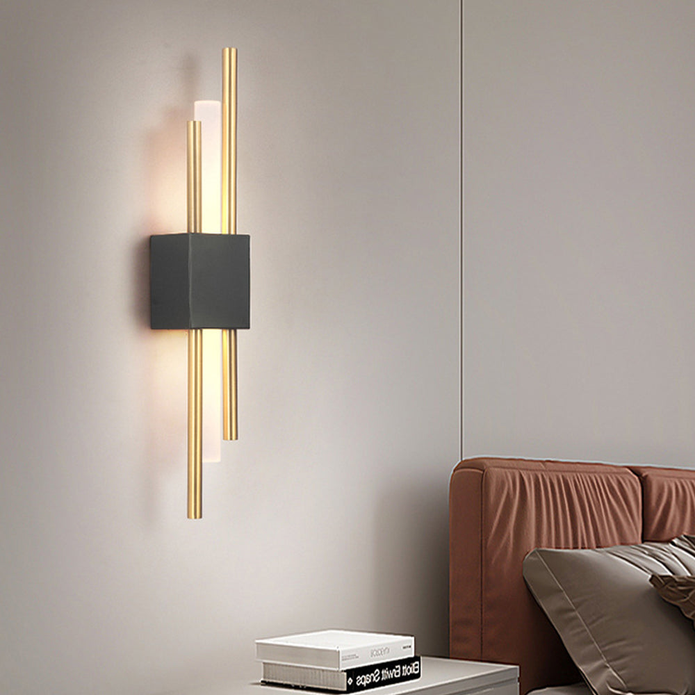 Modern qytu black and gold two-tone wall sconce serving as a striking architectural accent in a lounge