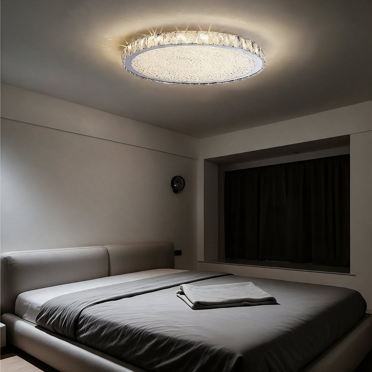 Raden crystal flush mount ceiling light in warm white above a bedroom with wood slat wall panelling and navy curtains