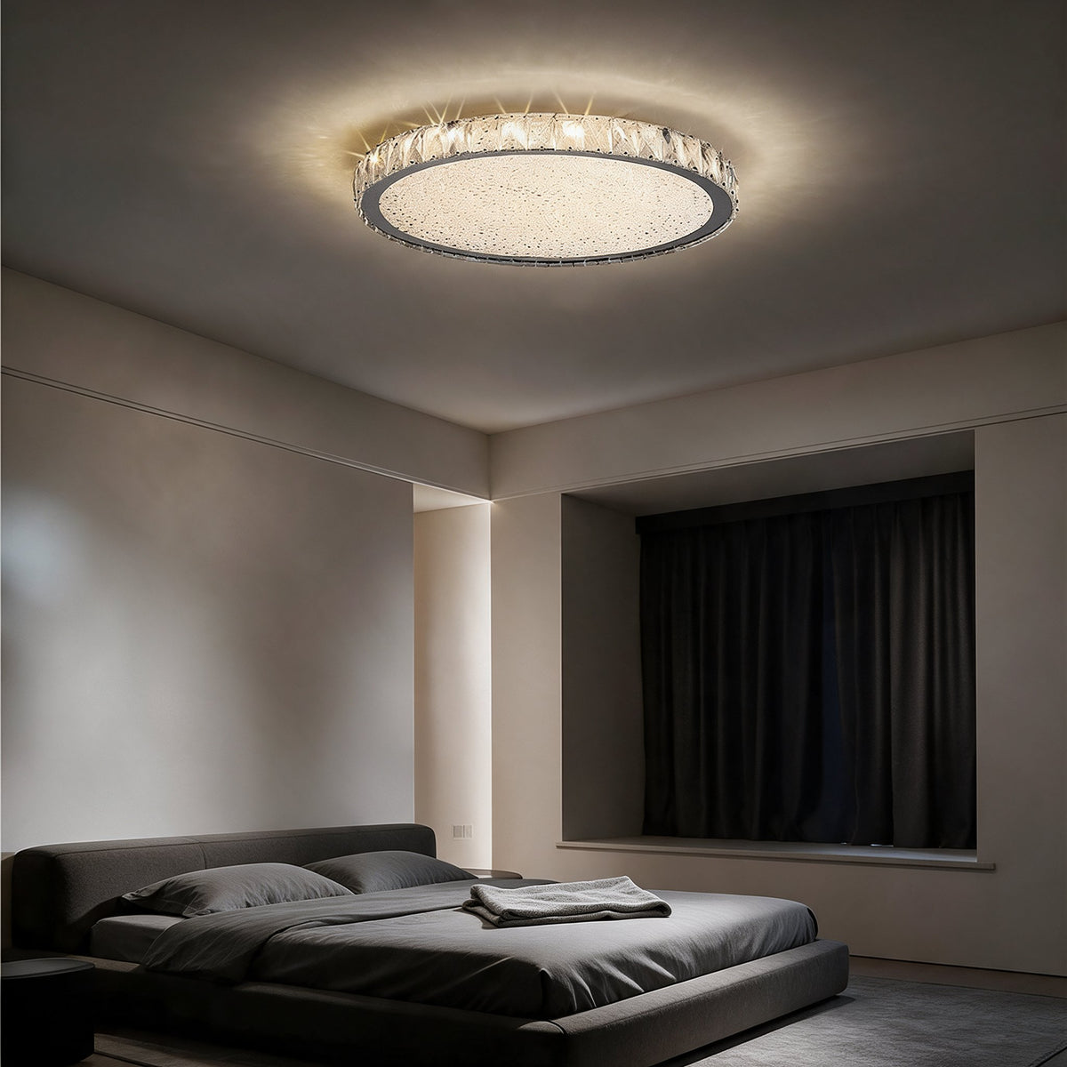 Raden crystal flush mount ceiling light in warm white above a bedroom with a dark leather bed and wood slat wall