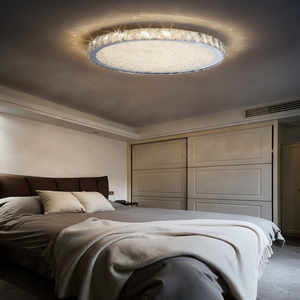 Raden crystal flush mount ceiling light in warm white above a bedroom with blue bedding and a white wardrobe