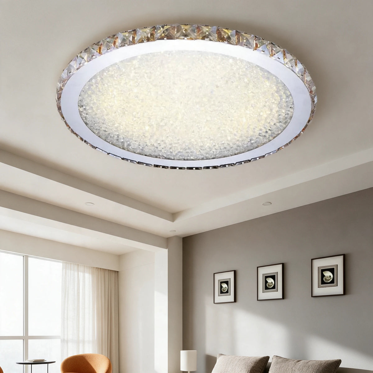 Raden crystal flush mount ceiling light in warm white above a living room with a large window and framed wall art