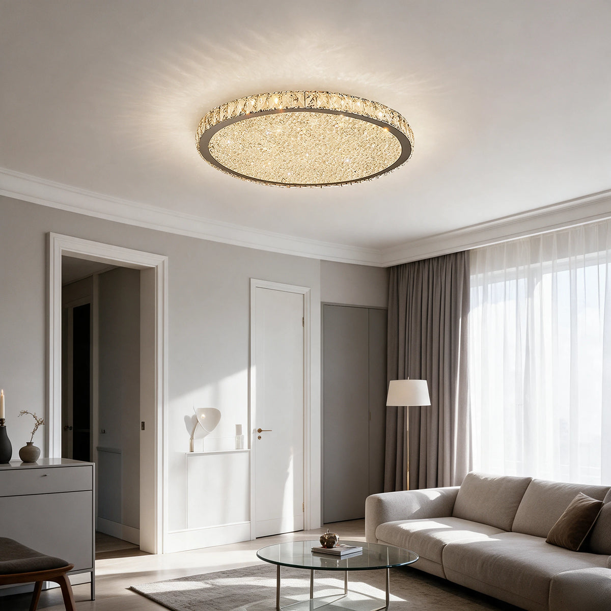 Raden crystal flush mount ceiling light in warm white above a living room with built-in shelving and a sofa