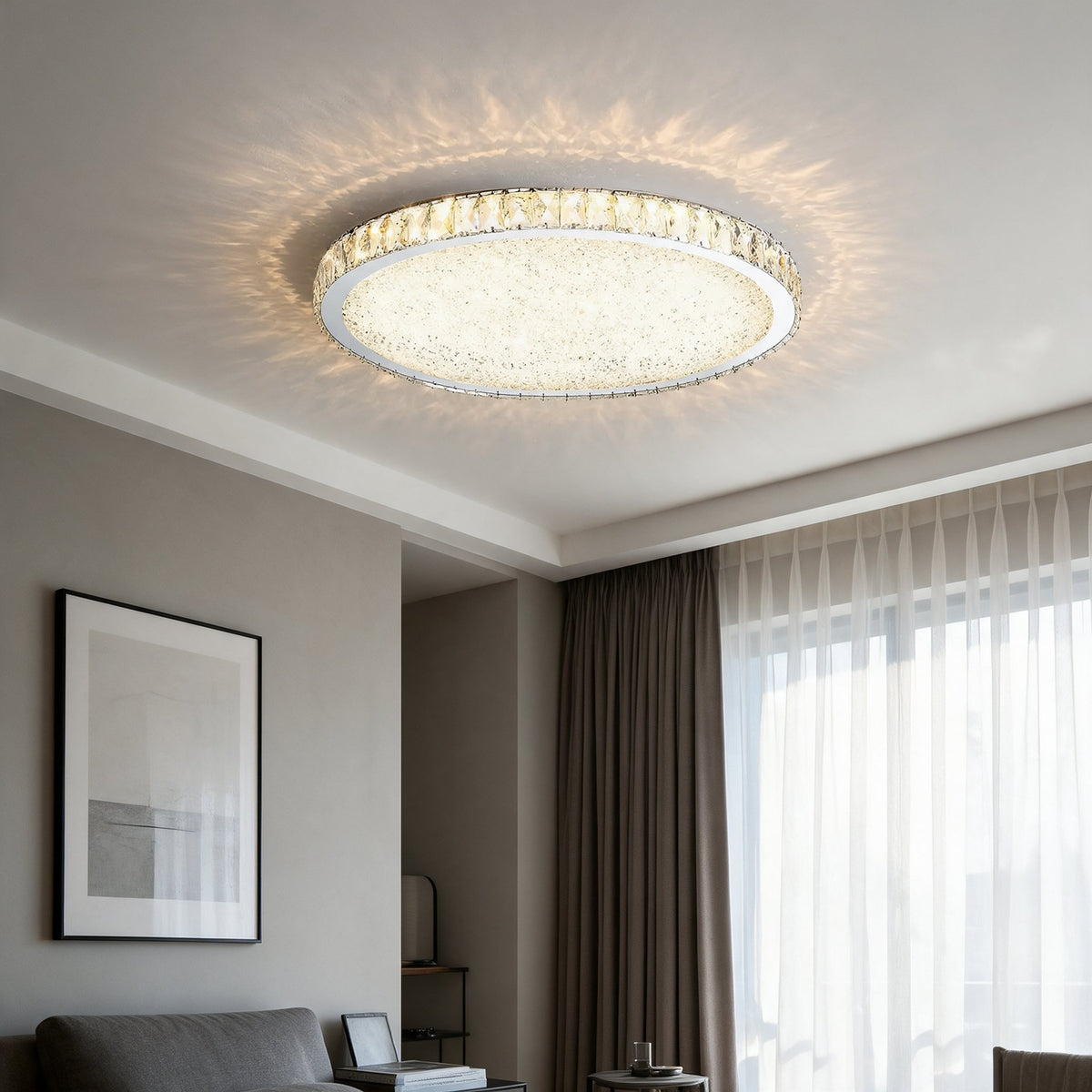 Raden crystal flush mount ceiling light in warm white above a living room with sheer curtains and framed wall art