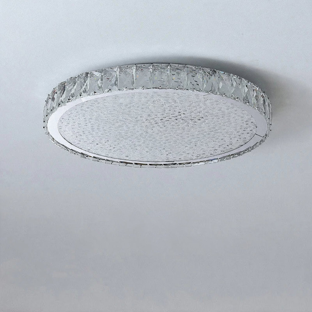 Raden crystal flush mount ceiling light unlit, angled studio shot on a plain grey background